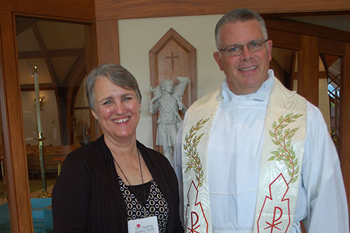 Debbie and Fr. Dennis O'Keeffe, pastor of St. Alphonsus